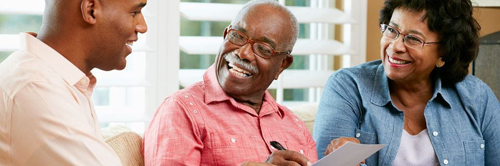 A couple reviews their retirement savings with a financial advisor.