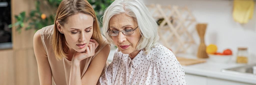 A senior woman talks to her daughter about establishing a medical power of attorney.