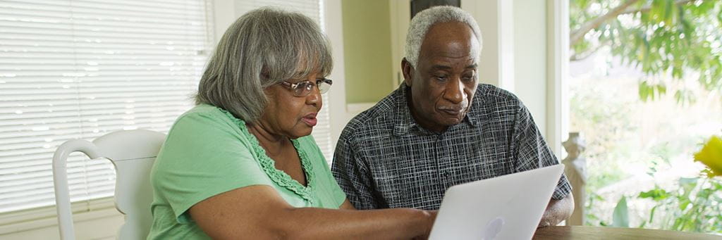 A senior couple plans their retirement savings by considering inflation.